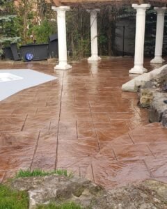 Sealed concrete backyard by the pool
