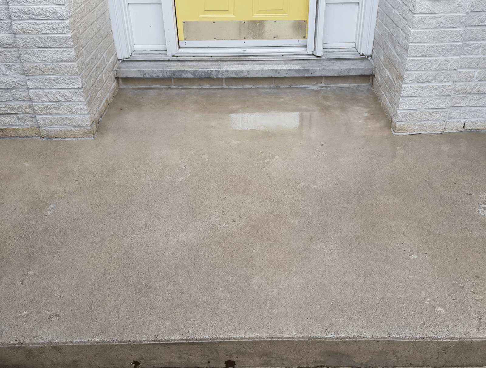 After picture of clean pressure washed concrete patio