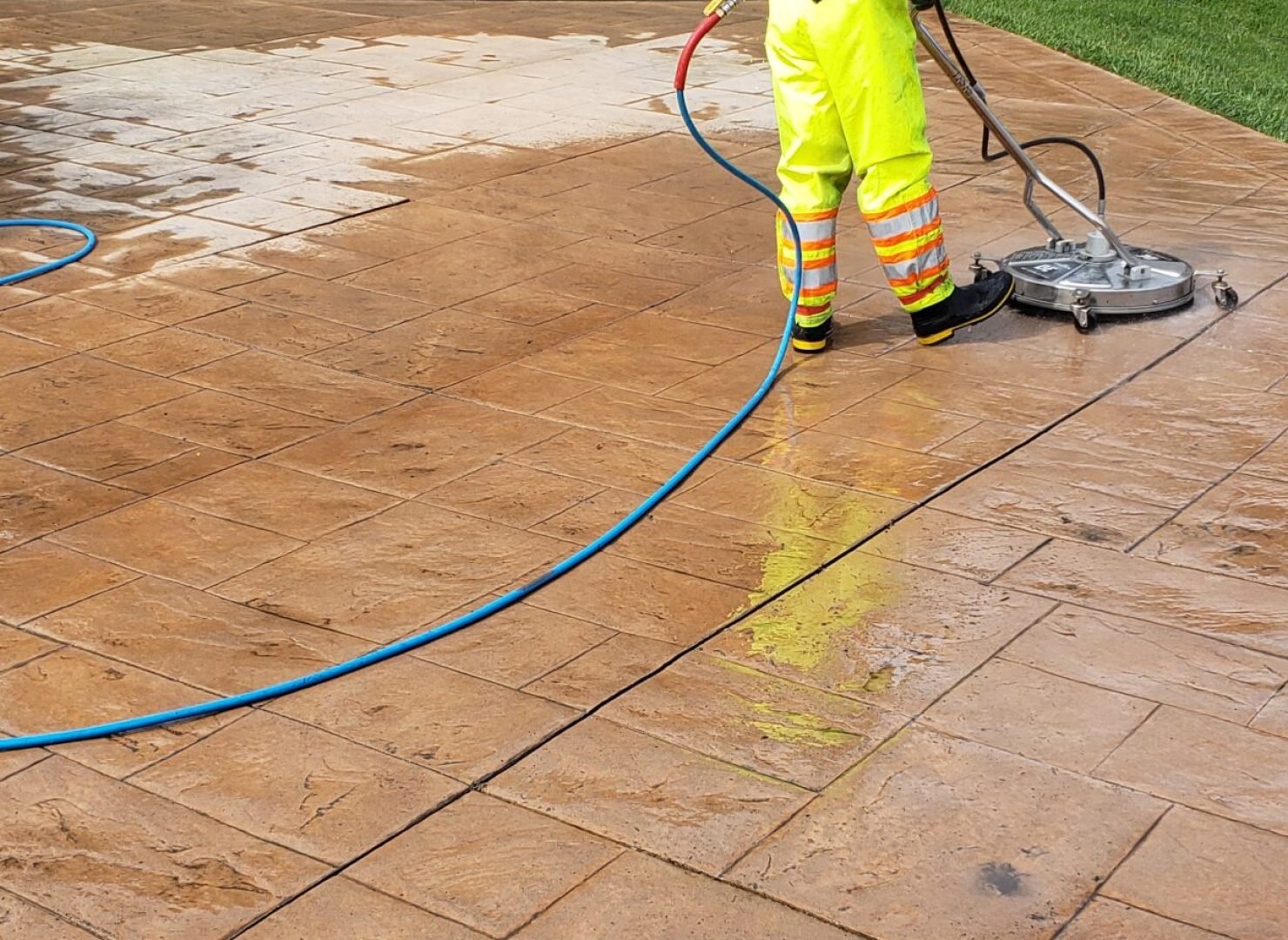 Nic Catalano Pressure washing and sealing a concrete driveway
