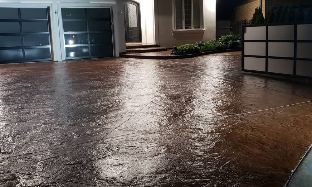 Washed and sealed stamped concrete driveway