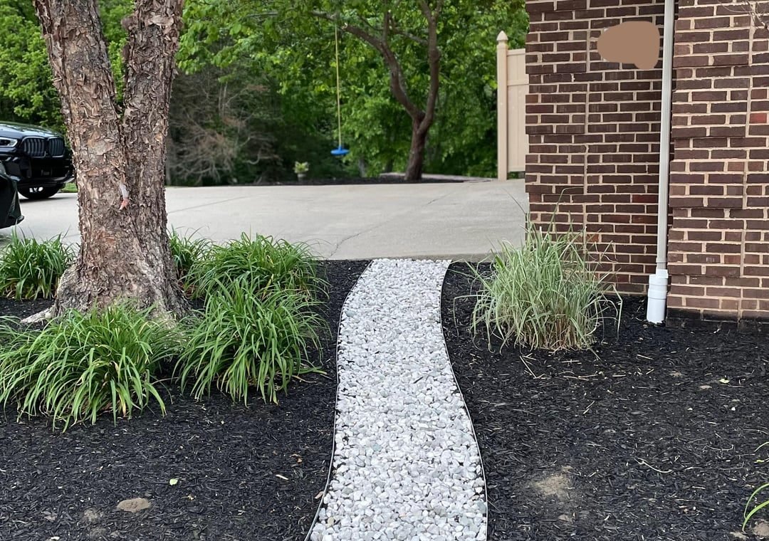 need help keeping mulch out of rock pathway